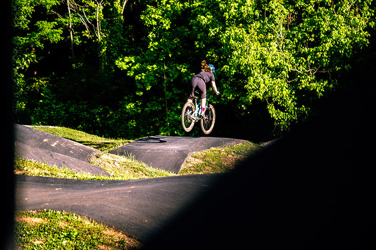 Caroline jumping on paved pump track