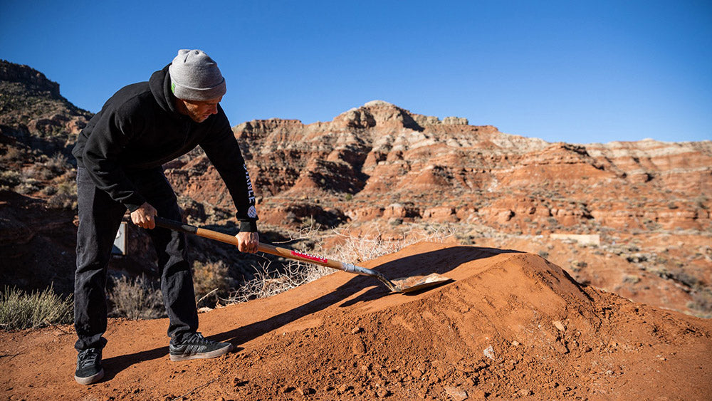Cam Zink packs down the Utah dirt on a jump at the 2021 Red Bull Rampage