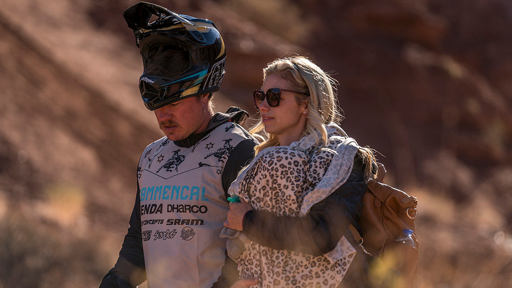 Kyle and Rachel Strait walking the course with their baby girl